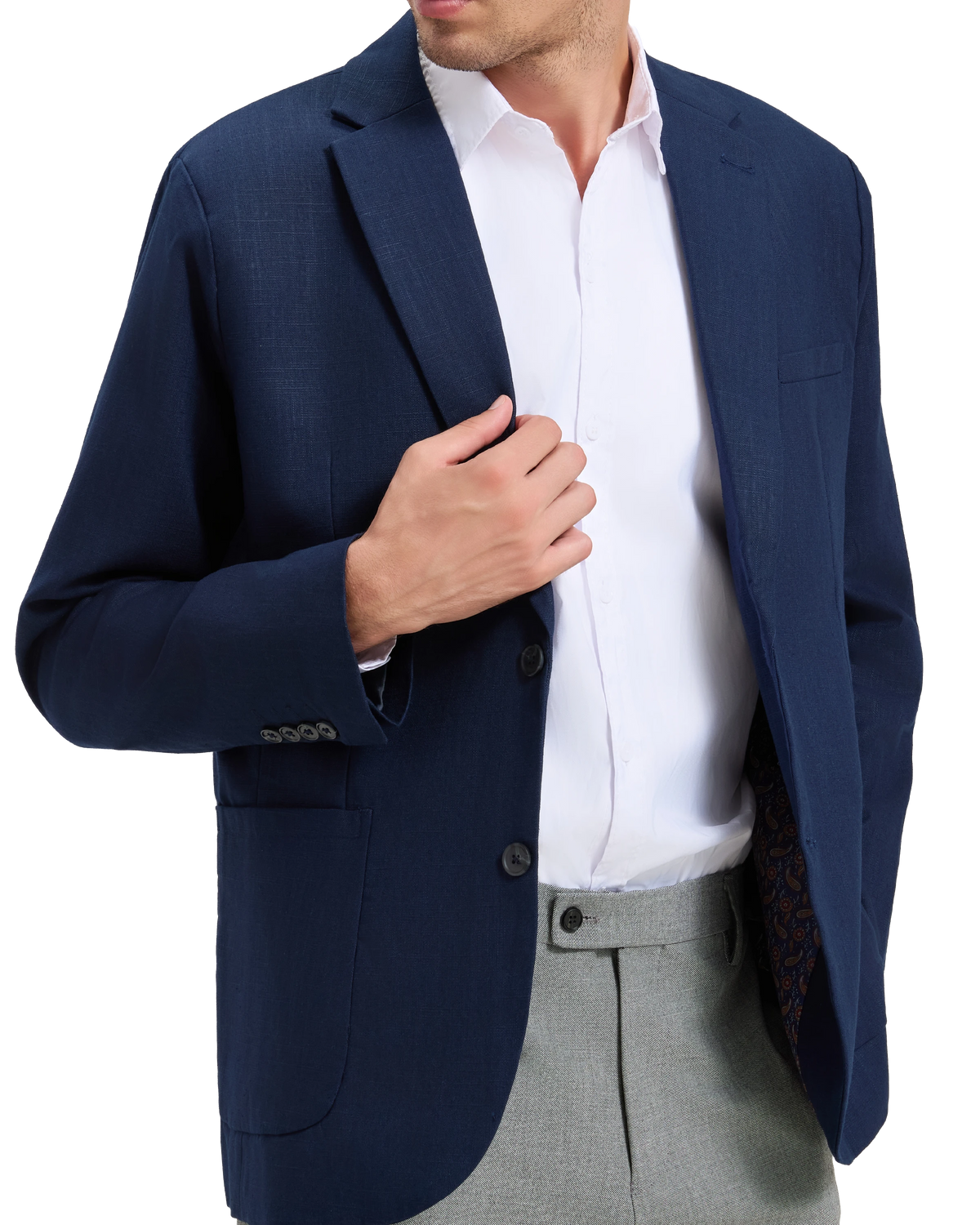Model fastening the front button of the navy linen blazer